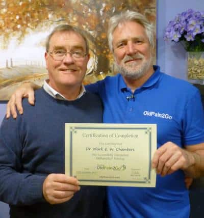 Dr Mark being presented with his certificate